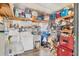 Organized laundry area features a washer, dryer, and storage shelves, blending functionality with household convenience at 215 Schooner St, North Port, FL 34287