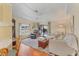 Comfortable living room with wood floors, plush seating, and a view of the outdoors, creating a relaxing atmosphere at 215 Schooner St, North Port, FL 34287