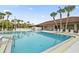 Community pool with lounge chairs and ample space for swimming and recreation at 215 Schooner St, North Port, FL 34287