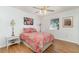 Cozy bedroom with a ceiling fan, side tables with lamps, and a window at 25413 Prada Dr, Punta Gorda, FL 33955