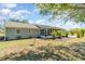 This home features a screened lanai, well-maintained lawn, and beautiful landscaping at 25413 Prada Dr, Punta Gorda, FL 33955