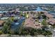 Aerial view of waterfront property with a pond, fountain, and a community swimming pool at 2645 W Marion Ave # 114, Punta Gorda, FL 33950