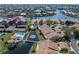 Aerial view of waterfront condos features a pool and pond with a bridge, in a beautiful neighborhood at 2645 W Marion Ave # 114, Punta Gorda, FL 33950
