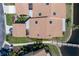 Overhead view of the property with terracotta tile roof, a bridge over the water, and lush landscaping at 2645 W Marion Ave # 114, Punta Gorda, FL 33950