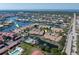 Real estate aerial view featuring community, waterway, neighboring houses, and overall surrounding area at 2645 W Marion Ave # 114, Punta Gorda, FL 33950