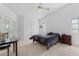 Bright bedroom with vaulted ceiling, neutral carpet, closet, and desk at 2645 W Marion Ave # 114, Punta Gorda, FL 33950