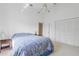 Bedroom with neutral carpet, vaulted ceiling, closet, and end table at 2645 W Marion Ave # 114, Punta Gorda, FL 33950