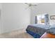 Bedroom with neutral carpet, vaulted ceiling, ceiling fan and large window at 2645 W Marion Ave # 114, Punta Gorda, FL 33950