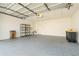 Spacious garage with epoxy flooring, shelving, and lots of storage space at 2645 W Marion Ave # 114, Punta Gorda, FL 33950