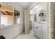 Functional laundry room with washer, dryer, and built-in storage, bathed in natural light at 2645 W Marion Ave # 114, Punta Gorda, FL 33950