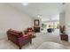 Bright living room with fireplace, neutral carpet and comfortable seating in a well-lit and inviting space at 2645 W Marion Ave # 114, Punta Gorda, FL 33950