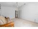 Living room with a ceiling fan, neutral-toned walls, and view to hallway at 2645 W Marion Ave # 114, Punta Gorda, FL 33950