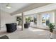 Bright living room with water views, neutral carpet, columns, black leather seating and a fountain at 2645 W Marion Ave # 114, Punta Gorda, FL 33950