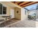 Outdoor patio with tile flooring, a beamed ceiling, and outdoor seating at 2645 W Marion Ave # 114, Punta Gorda, FL 33950