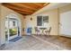 Tiled patio with outdoor seating area, a ceiling and views of the greenery at 2645 W Marion Ave # 114, Punta Gorda, FL 33950