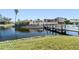 Charming waterfront property features a private dock, lush landscaping, and serene water views at 2645 W Marion Ave # 114, Punta Gorda, FL 33950