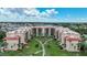 Beautiful aerial view of a condo complex with manicured landscaping and nearby city amenities at 3006 Caring Way # 329, Port Charlotte, FL 33952