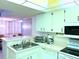 Bright kitchen featuring updated appliances, ample counter space and adjacent dining area at 3006 Caring Way # 329, Port Charlotte, FL 33952