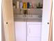 Convenient laundry area with washer, dryer, and storage at 3006 Caring Way # 329, Port Charlotte, FL 33952