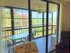 Enclosed patio with ceiling fan and outdoor seating, accessible from living area at 3006 Caring Way # 329, Port Charlotte, FL 33952