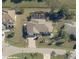 Aerial view of a home with a well-maintained lawn and an attached two-car garage at 32 Bariloche Dr, Punta Gorda, FL 33983