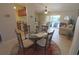 Dining area with a table and four chairs overlooking the living room at 32 Bariloche Dr, Punta Gorda, FL 33983