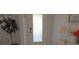 Inviting entryway features a decorative glass door, neutral walls, and stylish accents at 32 Bariloche Dr, Punta Gorda, FL 33983