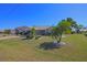 Charming home features a well-maintained lawn with tropical landscaping and a two-car garage at 32 Bariloche Dr, Punta Gorda, FL 33983