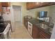 Kitchen features dark countertops and cabinetry, and stainless steel appliances at 32 Bariloche Dr, Punta Gorda, FL 33983