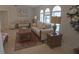Inviting living room featuring neutral-toned furniture and a cozy, floral-patterned rug at 32 Bariloche Dr, Punta Gorda, FL 33983
