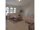Airy living room featuring lots of natural light and comfortable seating arrangements at 32 Bariloche Dr, Punta Gorda, FL 33983