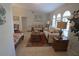 Bright living room with vaulted ceilings, tile flooring, and comfortable seating arrangement at 32 Bariloche Dr, Punta Gorda, FL 33983