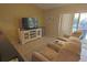Well-lit living area with comfortable seating and large windows overlooking a pool at 32 Bariloche Dr, Punta Gorda, FL 33983