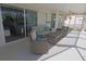 Relaxing covered patio with comfortable seating and a view of the pool area at 32 Bariloche Dr, Punta Gorda, FL 33983