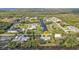 Aerial view of neighborhood with canal-front homes, lush landscaping, and convenient street access at 3436 Discovery Dr, Punta Gorda, FL 33983