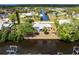 Aerial view of a home situated on a waterfront property with lush green landscaping at 3436 Discovery Dr, Punta Gorda, FL 33983