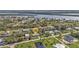 An aerial shot highlights the home's waterfront location, spacious yard, and access to nearby canals at 3436 Discovery Dr, Punta Gorda, FL 33983