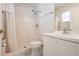 Bright bathroom featuring a tiled shower with curtain, and a vanity with sink and white cabinets at 3436 Discovery Dr, Punta Gorda, FL 33983