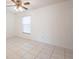 A well-lit bedroom with neutral walls, tile flooring, and a window with blinds at 3436 Discovery Dr, Punta Gorda, FL 33983