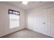 Bedroom featuring neutral carpet, a window with blinds, a ceiling fan, and a closet at 3436 Discovery Dr, Punta Gorda, FL 33983