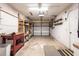 Spacious garage with work bench, overhead lighting, and a roll up door at 3436 Discovery Dr, Punta Gorda, FL 33983