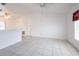 A bright and spacious living room with tile flooring and a vaulted ceiling with fans at 3436 Discovery Dr, Punta Gorda, FL 33983