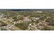 A wide aerial view shows rows of homes with landscaped yards, creating a picturesque and inviting community setting at 3956 Fairchild Ave, North Port, FL 34287