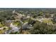 An aerial shot captures a charming residential area featuring well-kept homes, verdant trees, and a tranquil atmosphere at 3956 Fairchild Ave, North Port, FL 34287