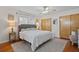 Comfortable bedroom with a ceiling fan, hardwood floors, and a neutral color palette at 3956 Fairchild Ave, North Port, FL 34287