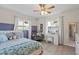 Bright bedroom with hardwood floors, natural light, and a cozy sitting area at 3956 Fairchild Ave, North Port, FL 34287