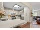 This bright and airy kitchen features stainless steel appliances, white cabinets, and an island at 3956 Fairchild Ave, North Port, FL 34287