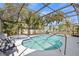 Screened-in pool and spa provide a tranquil oasis in the backyard at 3956 Fairchild Ave, North Port, FL 34287