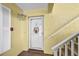 Inviting front door with welcome sign and unit number 217 at 4000 Bal Harbor Blvd # 217, Punta Gorda, FL 33950