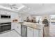 Bright kitchen featuring white cabinets, granite countertops, and stainless steel appliances at 4000 Bal Harbor Blvd # 217, Punta Gorda, FL 33950